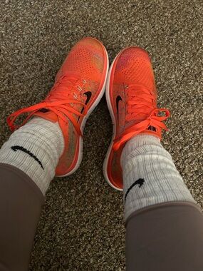 Nike Women’s Flyknit Running Sneakers - Neon Orange with Black Swoosh